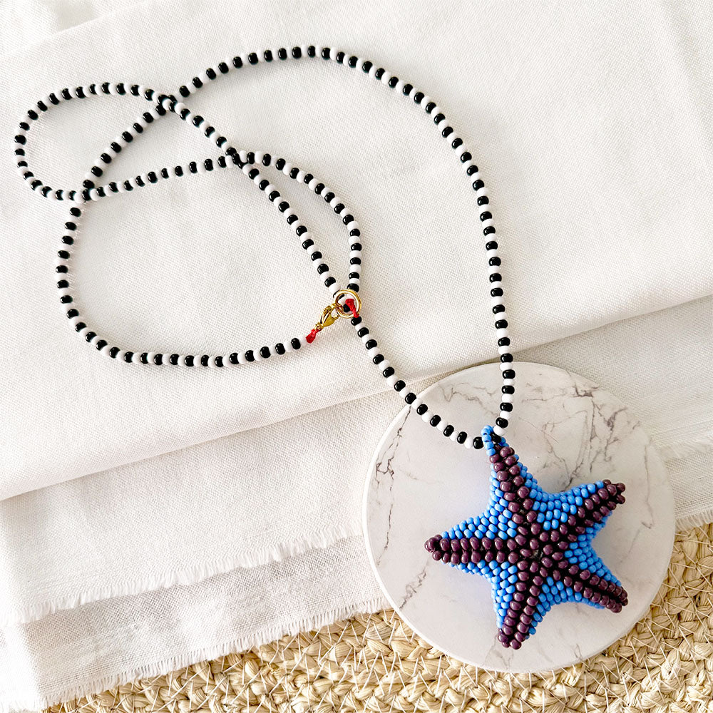Collar estrella morada